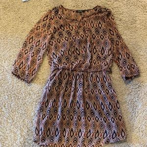 Slightly flowy dress with 3/4 sheer sleeves, dress has two layers, tie detail